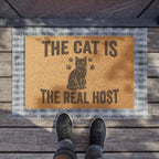 Doormat — "The Cat Is The Real Host" Cat Lover Welcome Mat